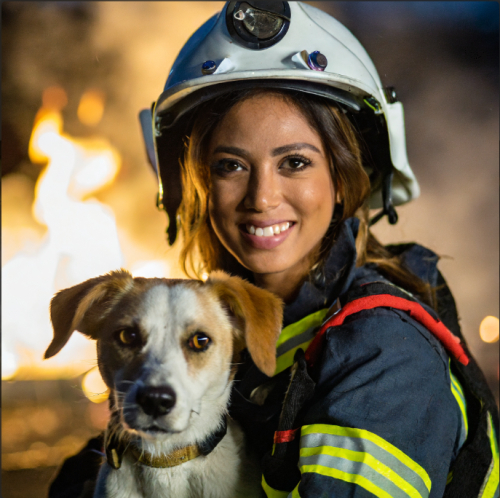 A firefighter rescuing a pet from a blaze, eyes protecting life, portrait, Canon EOS R5, f/2.0, ISO 320, 1/125 sec, heroic firefighter, fiery rescue, --ar 1:1 --v 5.2 --style raw